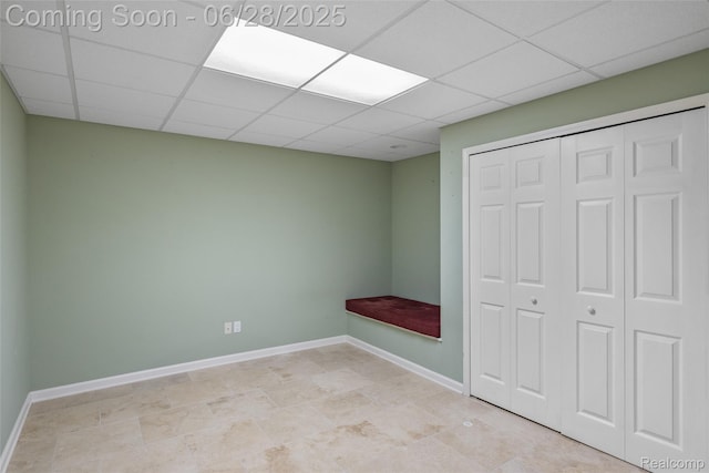 17601 Rolling Woods Cir, Northville, MI 48168 - unfurnished bedroom featuring a drop ceiling and a closet