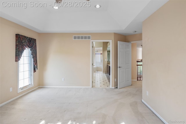17601 Rolling Woods Cir, Northville, MI 48168 - unfurnished bedroom featuring carpet and a tray ceiling
