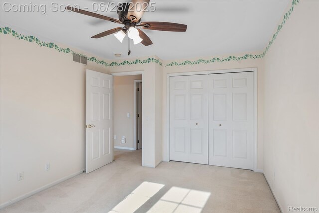 17601 Rolling Woods Cir, Northville, MI 48168 - unfurnished bedroom featuring light colored carpet, a closet, and a ceiling fan