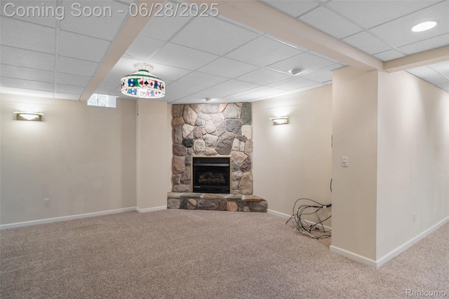 17601 Rolling Woods Cir, Northville, MI 48168 - unfurnished living room featuring a paneled ceiling, carpet flooring, and a fireplace
