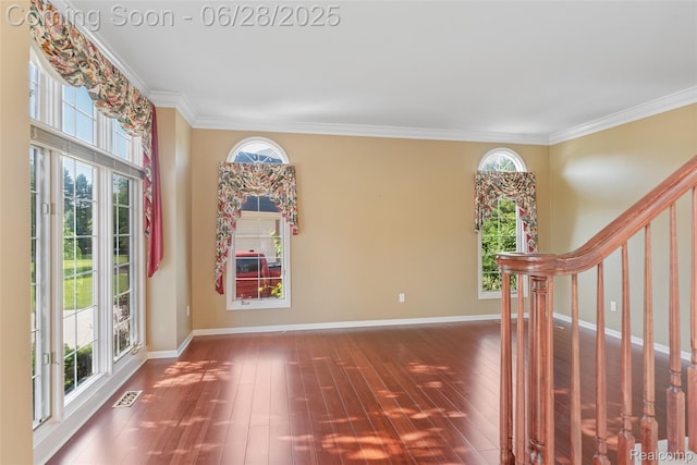 17601 Rolling Woods Cir, Northville, MI 48168 - entryway featuring plenty of natural light, crown molding, wood finished floors, and stairway