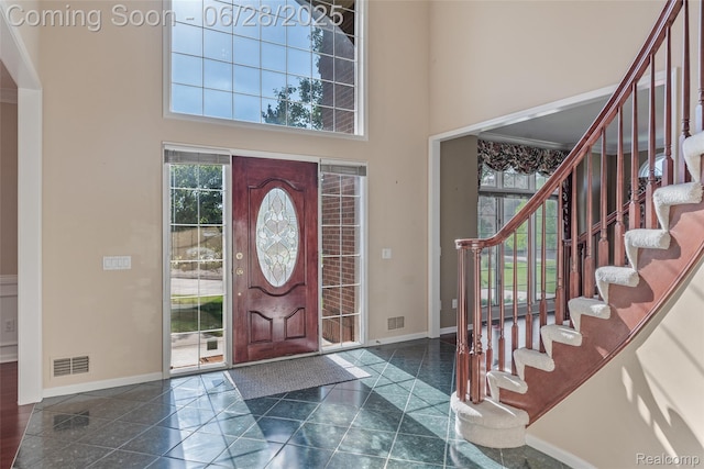 17601 Rolling Woods Cir, Northville, MI 48168 - foyer with a towering ceiling and stairway