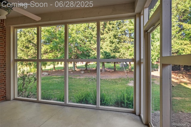 17601 Rolling Woods Cir, Northville, MI 48168 - unfurnished sunroom featuring a ceiling fan