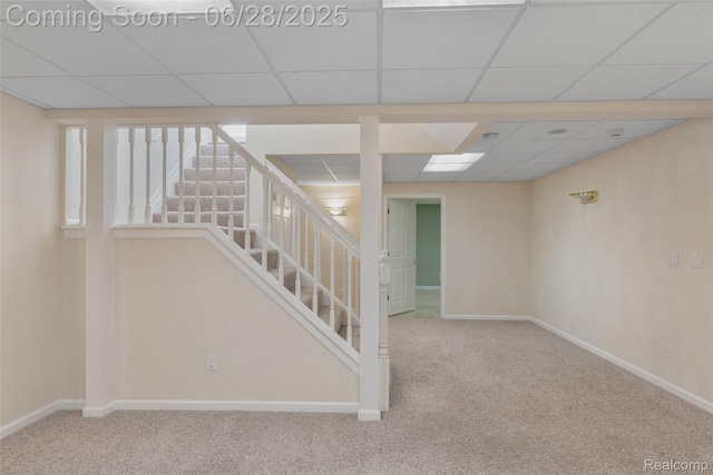 17601 Rolling Woods Cir, Northville, MI 48168 - below grade area with carpet floors, stairs, and a paneled ceiling