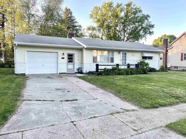 4704 Bishop St, Millington, MI 48746 - single story home with a garage, driveway, a chimney, and a front yard