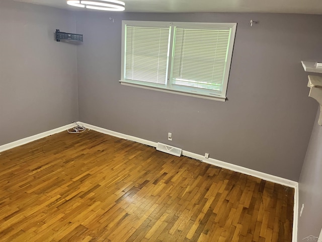 4704 Bishop St, Millington, MI 48746 - spare room featuring hardwood / wood-style floors and baseboards