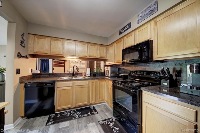 2635 Greenstone Blvd Unit 508, Auburn Hills, MI 48326 - kitchen with black appliances, light brown cabinets, light wood-style flooring, tasteful backsplash, and dark stone countertops