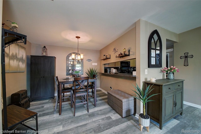 2635 Greenstone Blvd Unit 508, Auburn Hills, MI 48326 - dining space featuring light wood-style floors and a chandelier