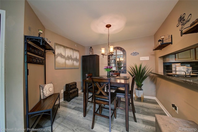 2635 Greenstone Blvd Unit 508, Auburn Hills, MI 48326 - dining room with a chandelier and light wood-style floors