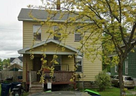 418 Adams St, Saginaw, MI 48708 - view of front facade with a porch