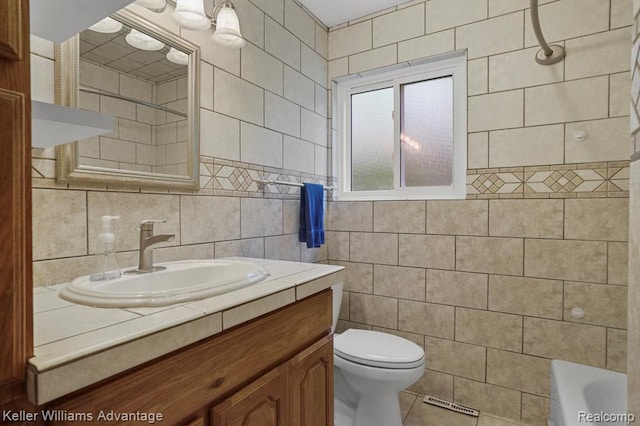274 Beaver St, Brighton, MI 48116 - full bathroom with tile walls, vanity, a bathtub, tile patterned floors, and a shower