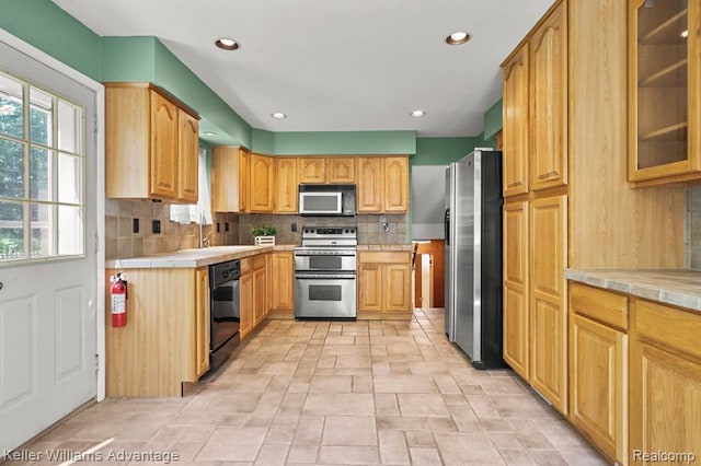 274 Beaver St, Brighton, MI 48116 - kitchen featuring stainless steel appliances, stone finish flooring, backsplash, glass insert cabinets, and recessed lighting