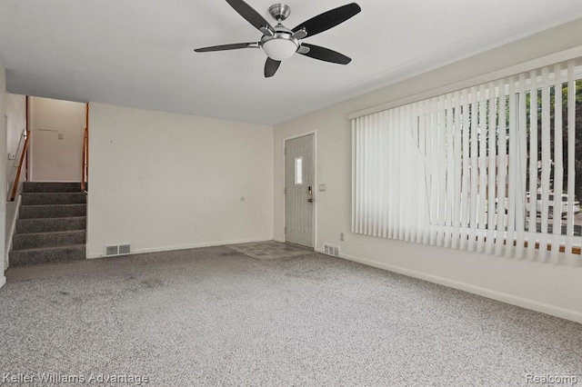 274 Beaver St, Brighton, MI 48116 - unfurnished living room with ceiling fan, carpet floors, and stairway