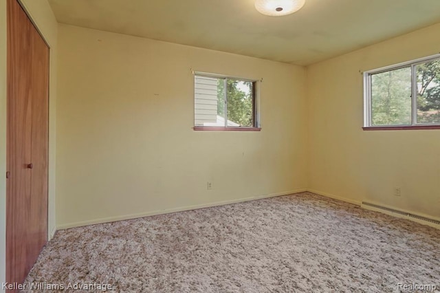 274 Beaver St, Brighton, MI 48116 - empty room featuring healthy amount of natural light, carpet, and a baseboard radiator