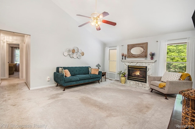 3675 S Commerce Rd, Commerce Twp, MI 48390 - living room with high vaulted ceiling, carpet flooring, ceiling fan, and a premium fireplace