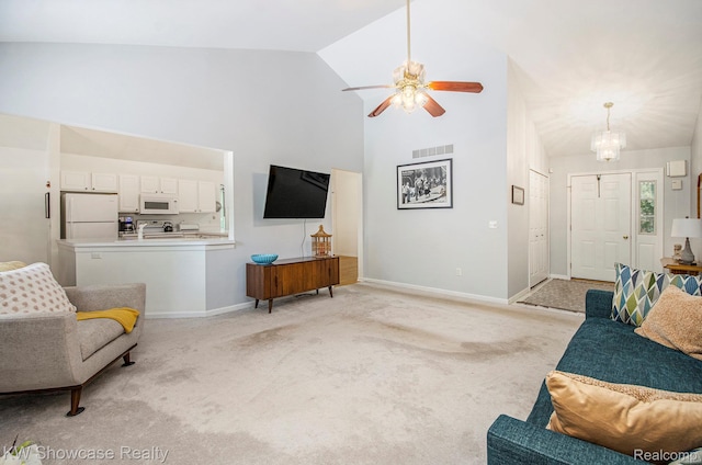 3675 S Commerce Rd, Commerce Twp, MI 48390 - living room featuring high vaulted ceiling, light carpet, a ceiling fan, and a chandelier