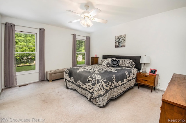 3675 S Commerce Rd, Commerce Twp, MI 48390 - carpeted bedroom featuring baseboards and ceiling fan