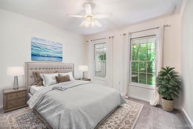 3675 S Commerce Rd, Commerce Twp, MI 48390 - carpeted bedroom featuring baseboards and ceiling fan