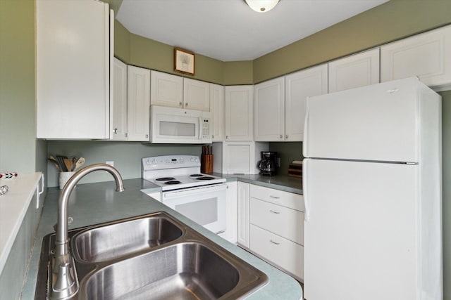 12350 S Butternut Ave, Sand Lake, MI 49343 - kitchen with white appliances, white cabinetry, and dark countertops