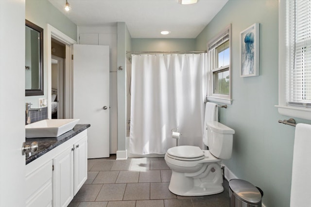 12350 S Butternut Ave, Sand Lake, MI 49343 - bathroom featuring vanity, tile patterned floors, and shower / bathtub combination with curtain