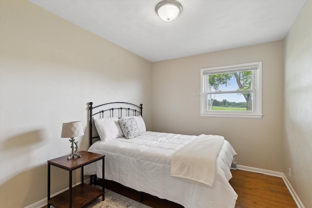 12350 S Butternut Ave, Sand Lake, MI 49343 - bedroom with baseboards and wood finished floors