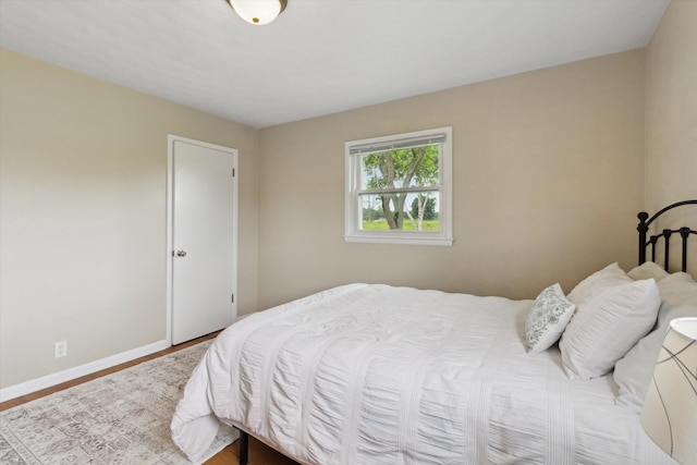 12350 S Butternut Ave, Sand Lake, MI 49343 - bedroom with wood finished floors and baseboards