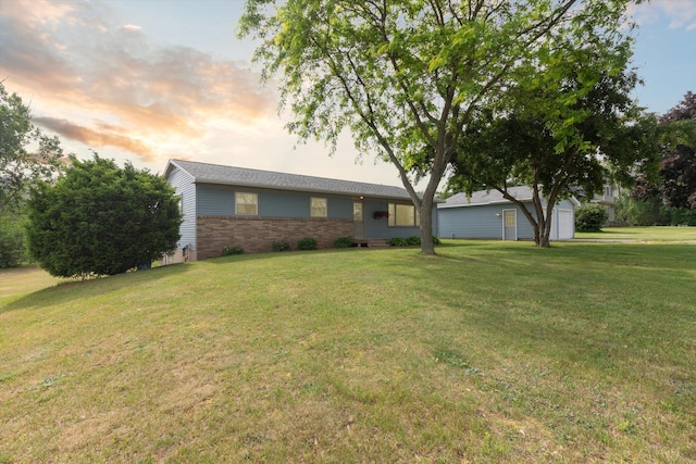 12350 S Butternut Ave, Sand Lake, MI 49343 - single story home with a front lawn and brick siding