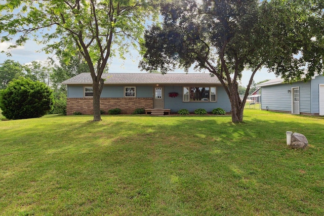 12350 S Butternut Ave, Sand Lake, MI 49343 - ranch-style house with a front yard and brick siding