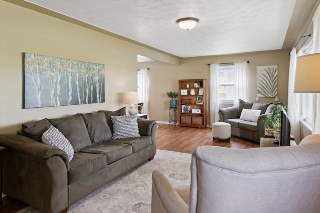 12350 S Butternut Ave, Sand Lake, MI 49343 - living area featuring wood finished floors and baseboards