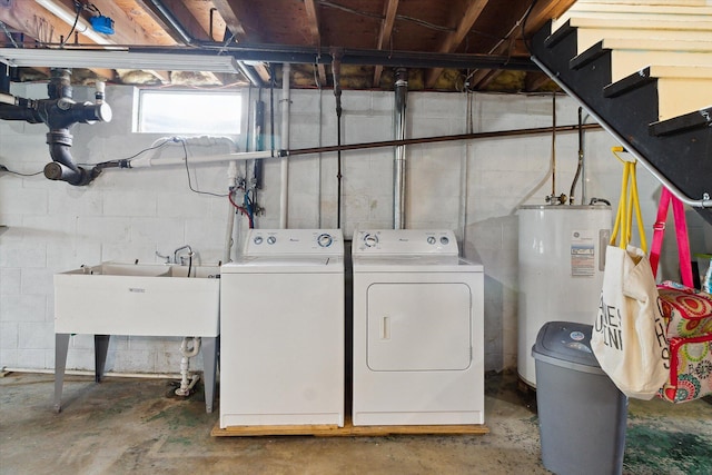 12350 S Butternut Ave, Sand Lake, MI 49343 - laundry area with water heater and washing machine and clothes dryer