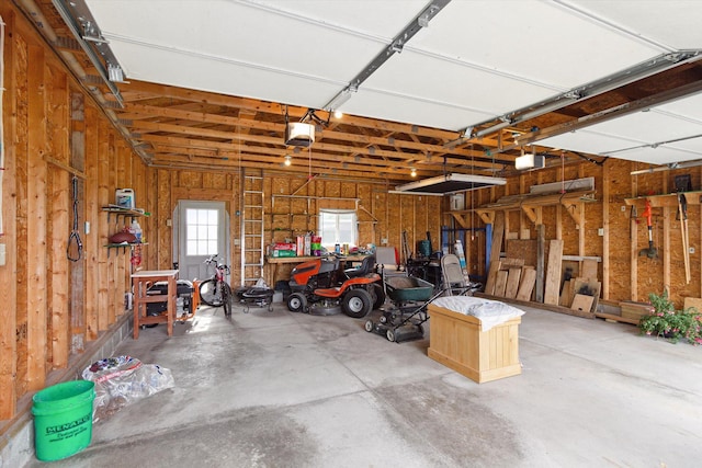 12350 S Butternut Ave, Sand Lake, MI 49343 - garage with a garage door opener