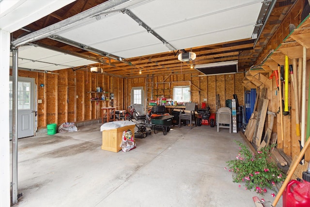 12350 S Butternut Ave, Sand Lake, MI 49343 - garage with a garage door opener