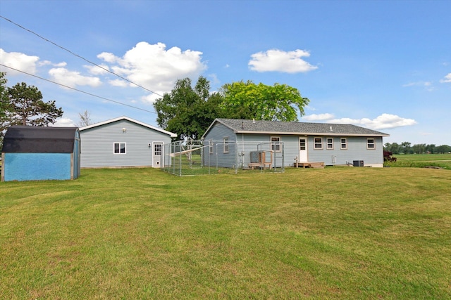 12350 S Butternut Ave, Sand Lake, MI 49343 - back of property with a lawn