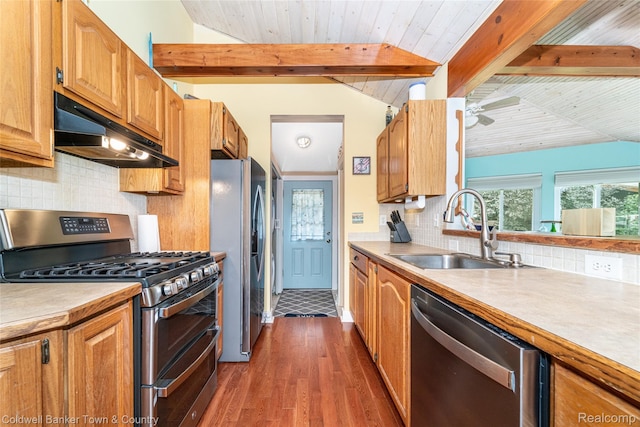 11729 Algonquin Dr, Pinckney, MI 48169 - kitchen featuring appliances with stainless steel finishes, under cabinet range hood, dark wood-style floors, backsplash, and light countertops