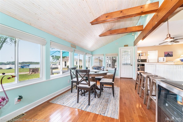 11729 Algonquin Dr, Pinckney, MI 48169 - dining room with hardwood / wood-style floors, a ceiling fan, and a water view
