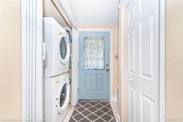 11729 Algonquin Dr, Pinckney, MI 48169 - laundry room with stacked washing machine and dryer and light tile patterned floors