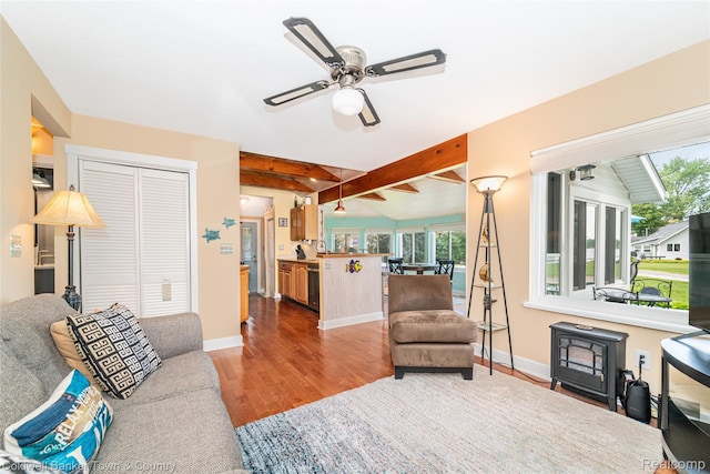 11729 Algonquin Dr, Pinckney, MI 48169 - living room featuring wood finished floors, ceiling fan, and beam ceiling