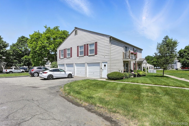 3043 Oakridge Ct, Lake Orion, MI 48360 - view of side of property featuring a balcony, asphalt driveway, a garage, and a yard