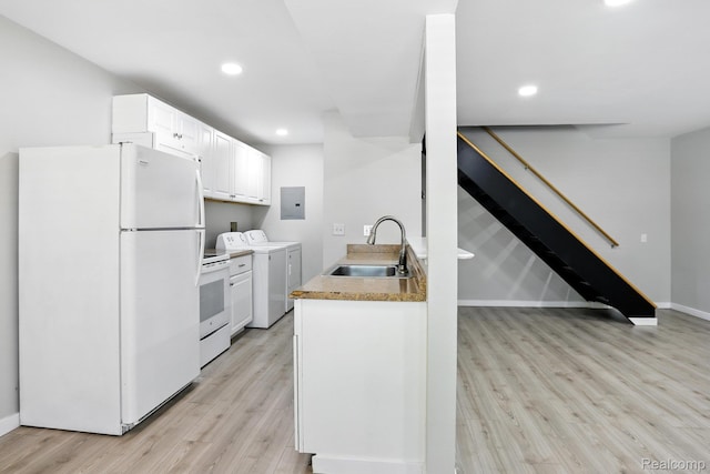 3043 Oakridge Ct, Lake Orion, MI 48360 - kitchen with white appliances, electric panel, light wood-type flooring, washer and clothes dryer, and white cabinets