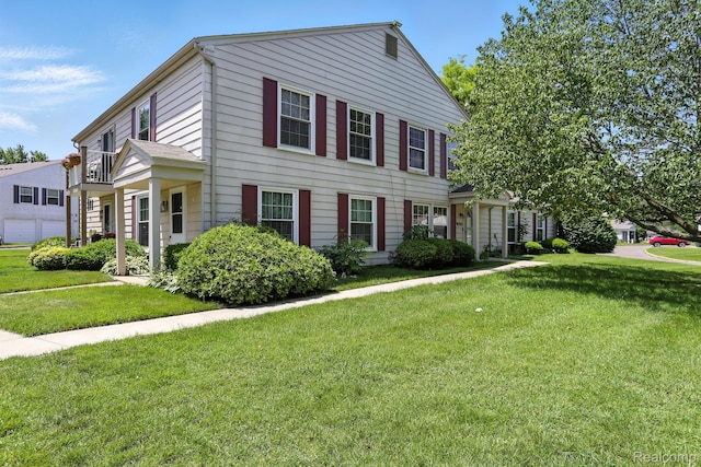 3043 Oakridge Ct, Lake Orion, MI 48360 - view of front of property with a front yard and a balcony