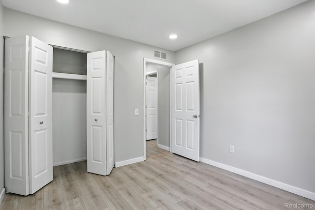 3043 Oakridge Ct, Lake Orion, MI 48360 - unfurnished bedroom featuring light wood-type flooring, recessed lighting, and a closet