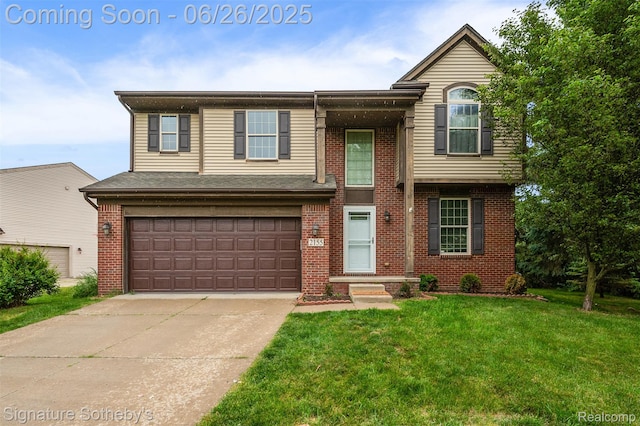 2155 Canal St, Commerce Twp, MI 48382 - view of front facade with a front lawn, brick siding, an attached garage, and driveway