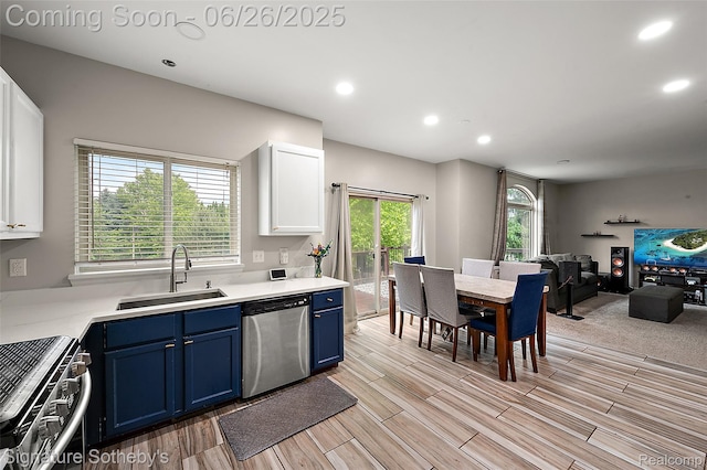 2155 Canal St, Commerce Twp, MI 48382 - kitchen featuring stainless steel appliances, blue cabinets, white cabinets, wood finish floors, and recessed lighting