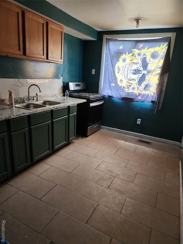 7458 E Quinn St, Detroit, MI 48234 - kitchen featuring stainless steel gas stove and a sink