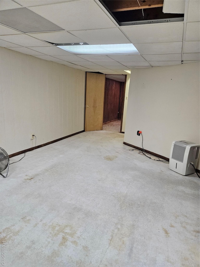 3976 Bristol Dr, Troy, MI 48083 - finished basement featuring carpet flooring, a drop ceiling, and wooden walls