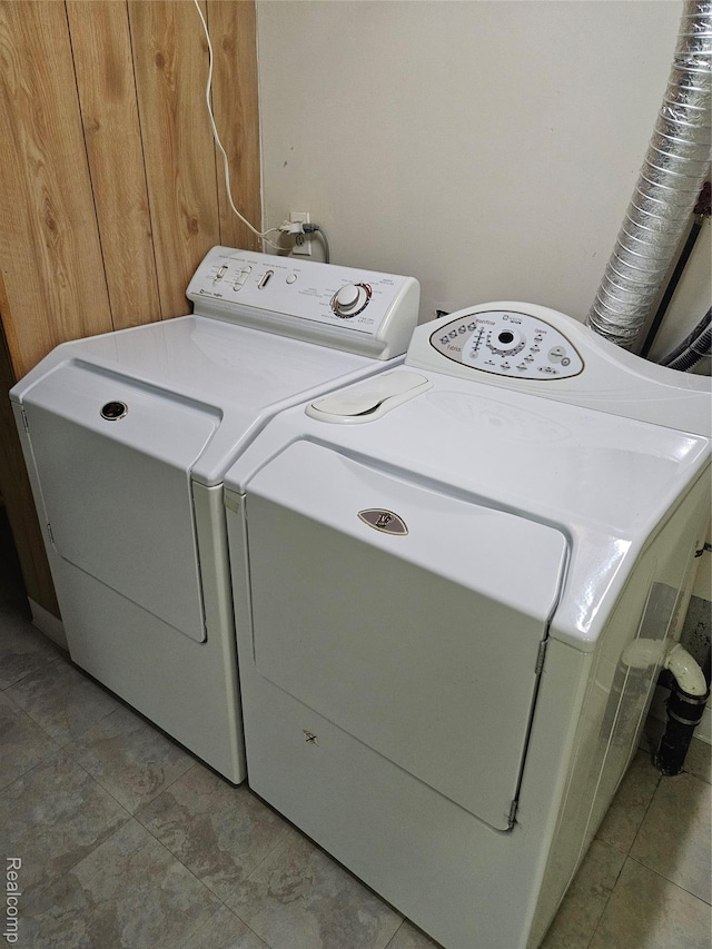 3976 Bristol Dr, Troy, MI 48083 - washroom with washing machine and clothes dryer and light tile patterned floors