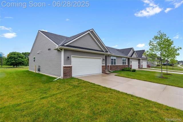 10001 Swan Lake Cir, Ypsilanti, MI 48197 - view of front of property with a garage, driveway, a front yard, and brick siding