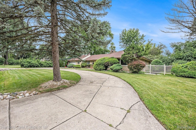19100 Coral Gables St, Southfield, MI 48076 - view of front of property with curved driveway and a chimney