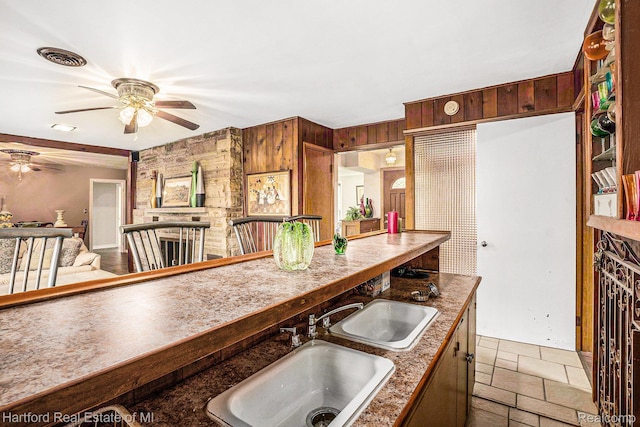 19100 Coral Gables St, Southfield, MI 48076 - kitchen with ceiling fan and wood walls