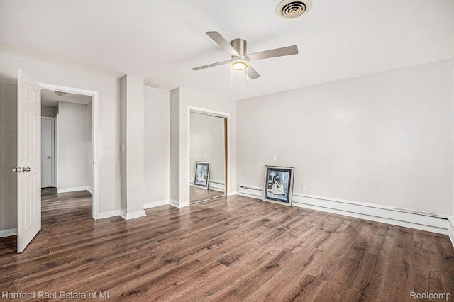 19100 Coral Gables St, Southfield, MI 48076 - unfurnished bedroom with wood finished floors, a closet, ceiling fan, and a baseboard heating unit